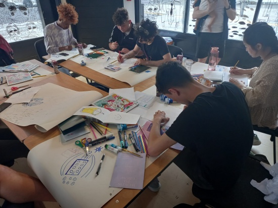 Our second Cohort working out ideas for their groups logo at 42nd Street Manchester